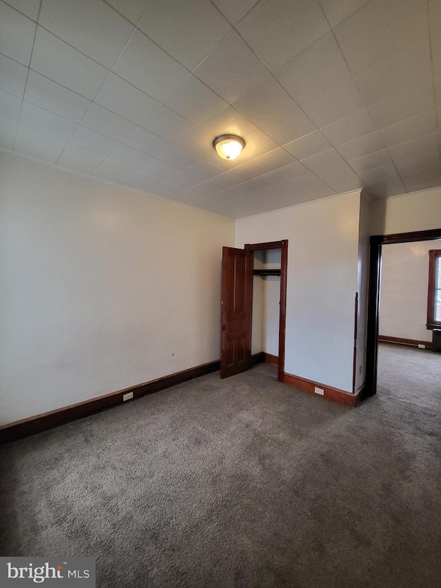 unfurnished bedroom featuring carpet flooring