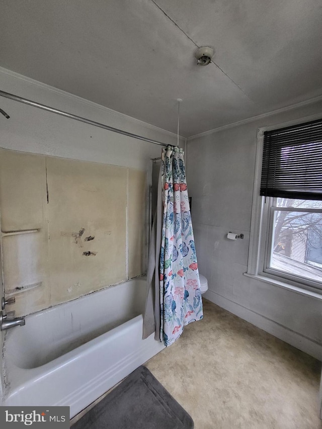 bathroom with toilet, ornamental molding, and shower / bath combo with shower curtain