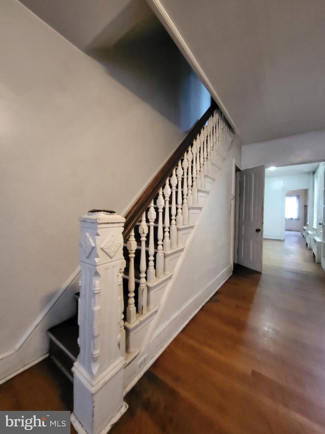 staircase featuring hardwood / wood-style floors