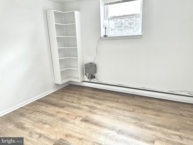 spare room with hardwood / wood-style floors