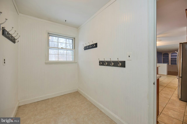 laundry area featuring ornamental molding