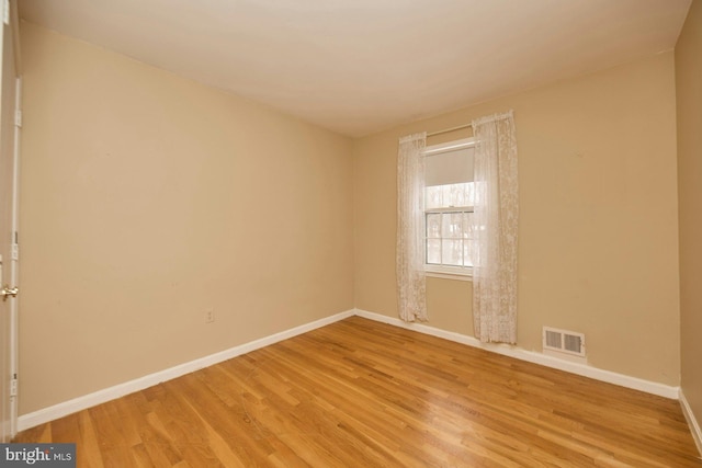 empty room featuring hardwood / wood-style flooring