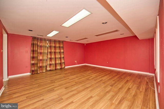 spare room featuring hardwood / wood-style floors