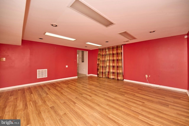 spare room with light hardwood / wood-style floors