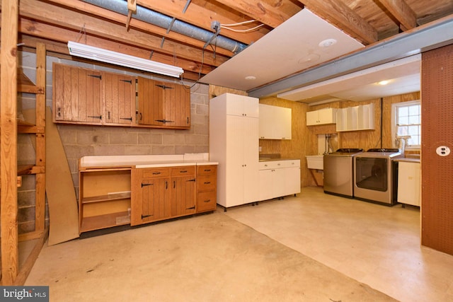 basement with sink and separate washer and dryer