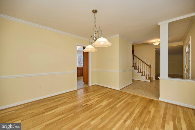 unfurnished room featuring light hardwood / wood-style flooring and crown molding