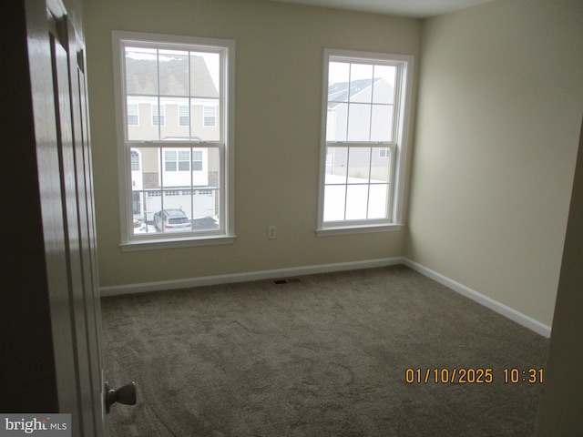 view of carpeted spare room