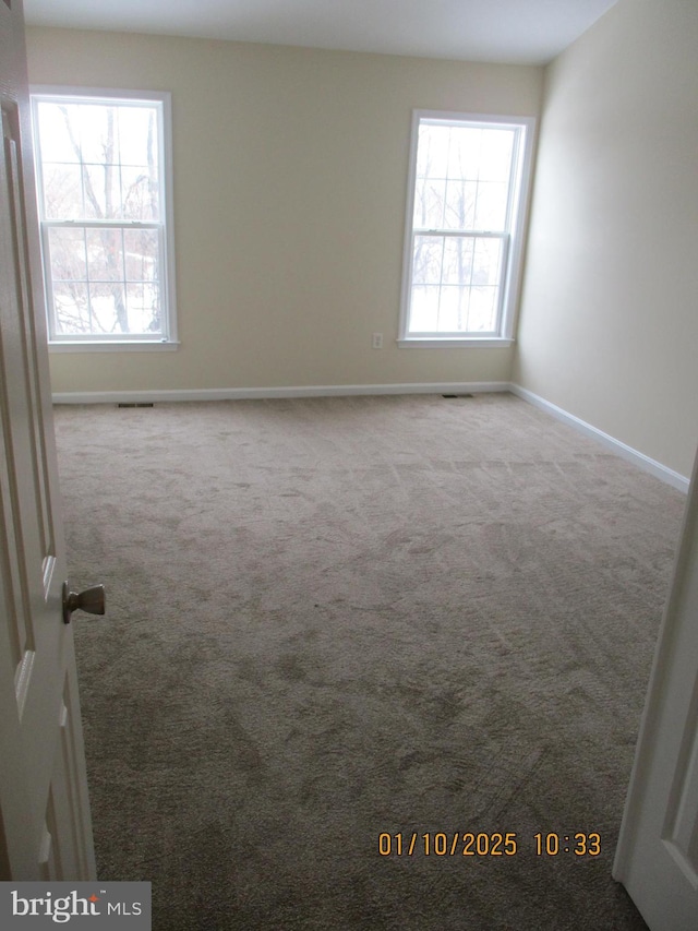 view of carpeted spare room