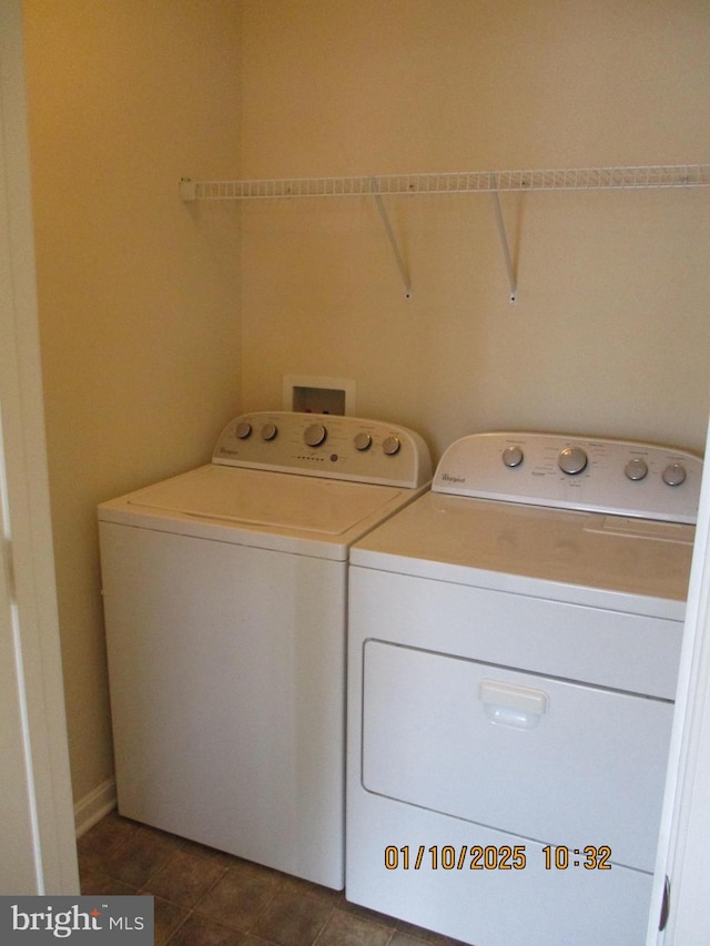 laundry area with washing machine and clothes dryer