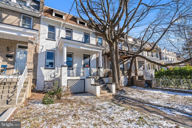 multi unit property featuring a porch