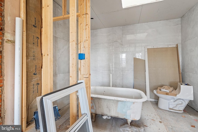 bathroom with a bathing tub and toilet