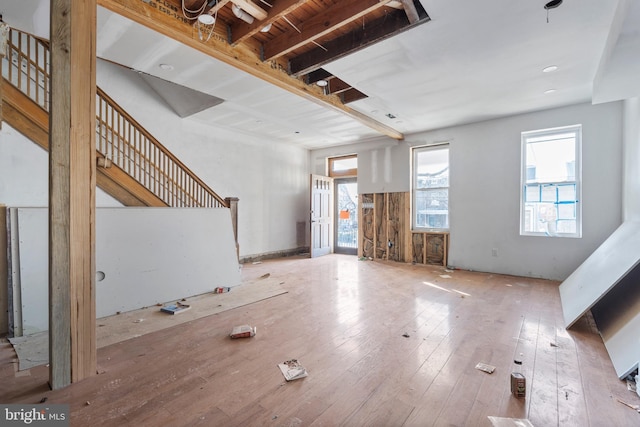 unfurnished living room featuring light wood-type flooring