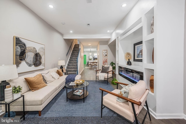 living room featuring built in shelves