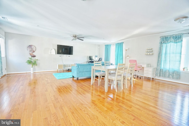 dining room featuring light hardwood / wood-style floors and ceiling fan