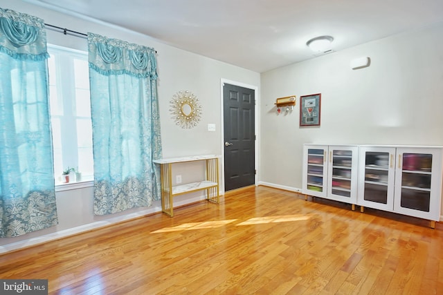 unfurnished room featuring wood-type flooring