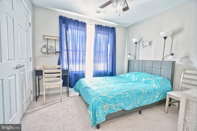 bedroom featuring ceiling fan and carpet floors