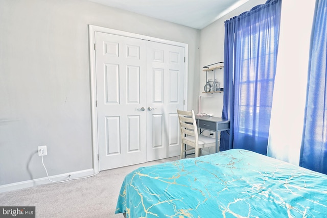 carpeted bedroom with a closet