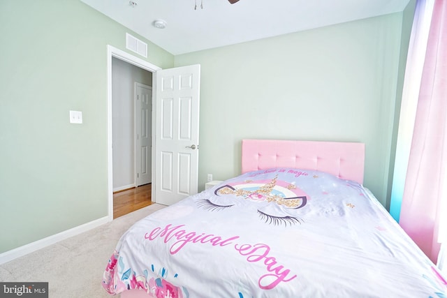 carpeted bedroom featuring ceiling fan