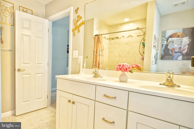 bathroom featuring vanity and a shower with shower curtain