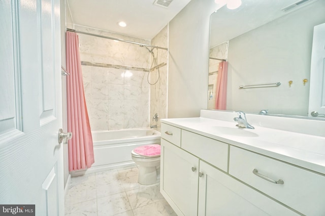 full bathroom with toilet, vanity, and shower / tub combo