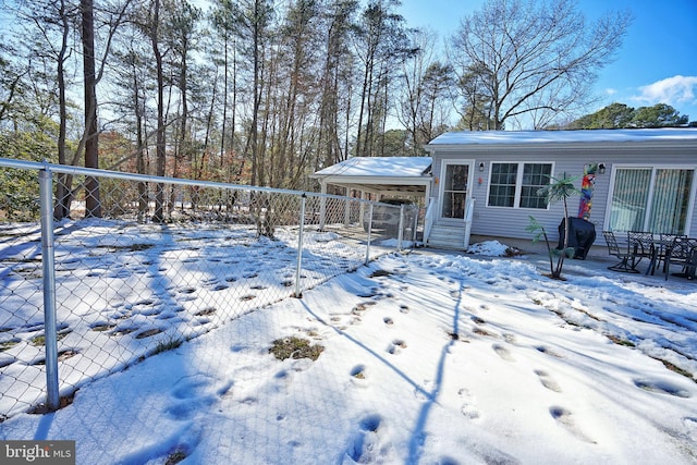 snow covered deck with area for grilling