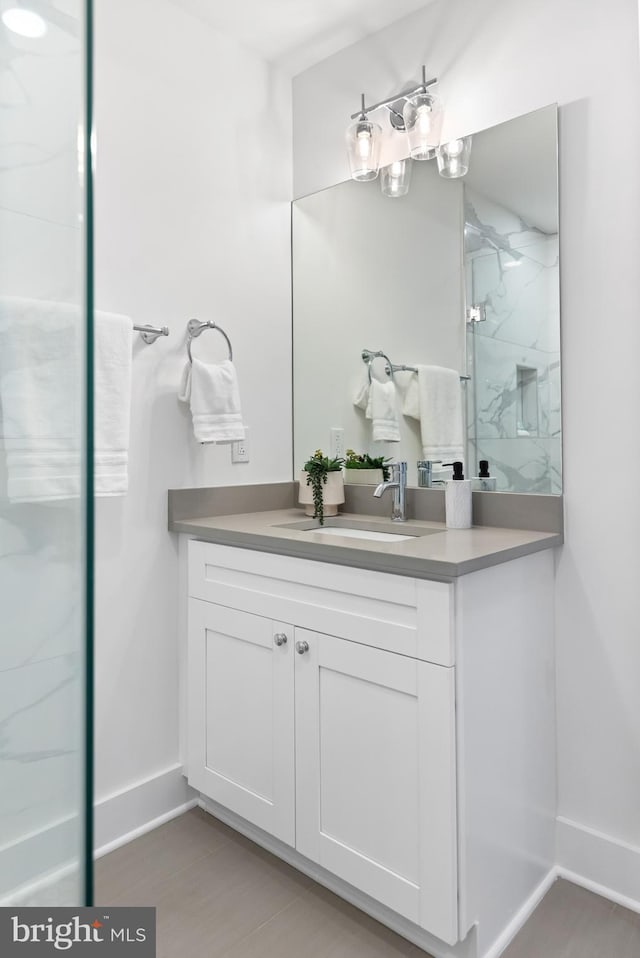 bathroom with a shower and vanity