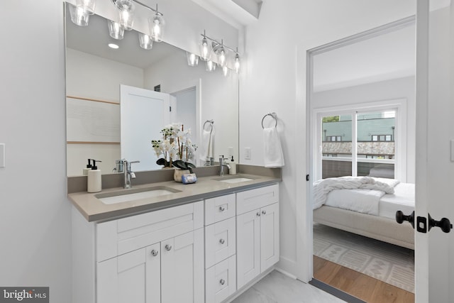 bathroom with vanity and wood-type flooring