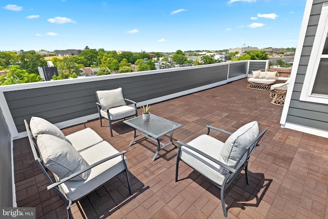 view of patio / terrace featuring an outdoor living space and a balcony