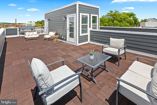 view of patio / terrace with a balcony and an outdoor hangout area