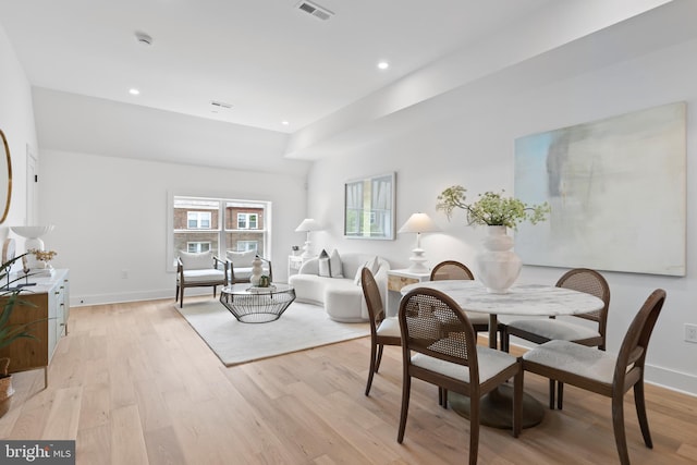 dining area with light hardwood / wood-style floors