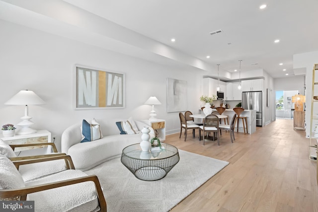 living room featuring light wood-type flooring