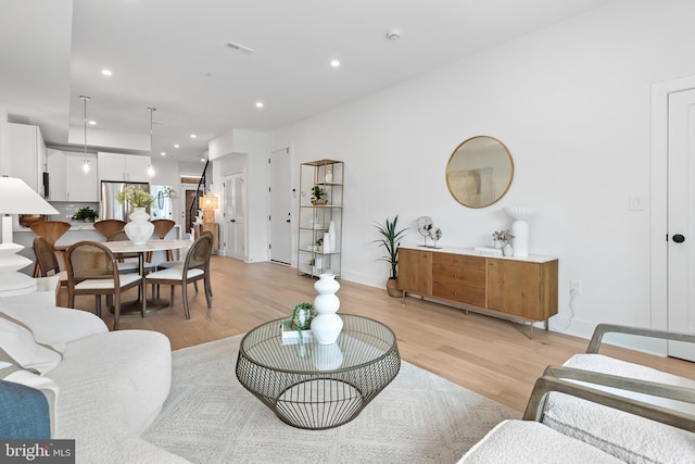 living room with light hardwood / wood-style flooring