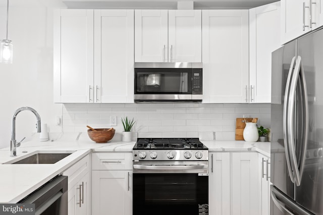 kitchen featuring appliances with stainless steel finishes and white cabinets