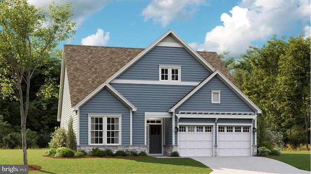 view of front of home with a front lawn and a garage