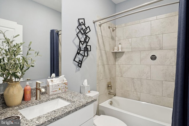 full bathroom featuring toilet, vanity, and shower / tub combo with curtain