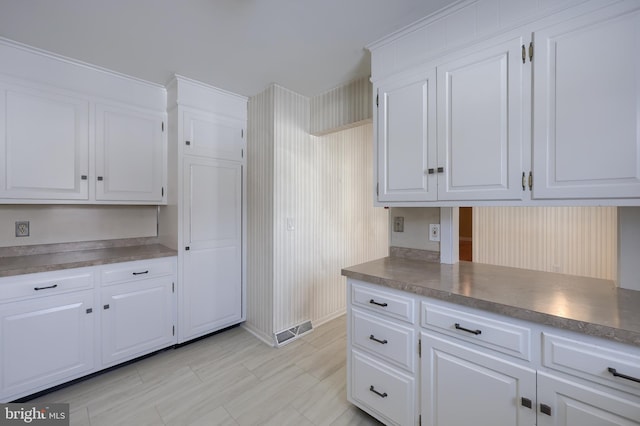 kitchen featuring white cabinetry