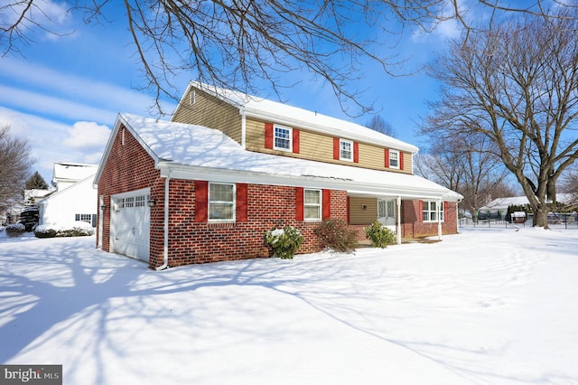 view of front of property with a garage and a porch