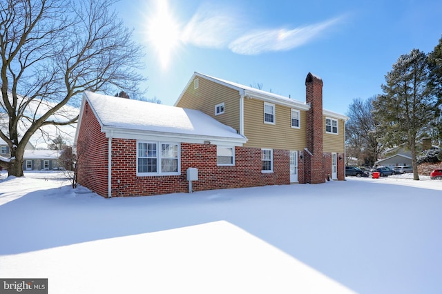 view of snow covered house