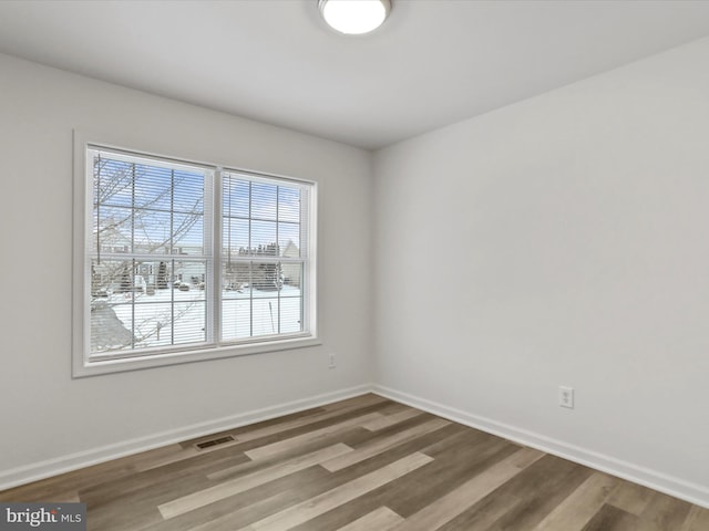 empty room featuring hardwood / wood-style floors