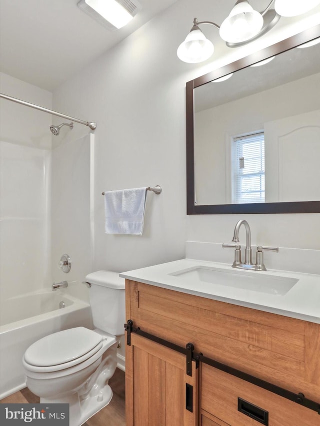 full bathroom with  shower combination, toilet, and vanity