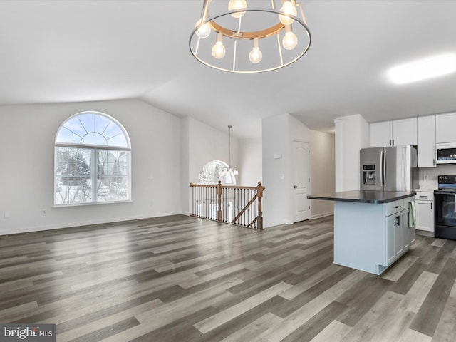 kitchen featuring an inviting chandelier, decorative light fixtures, stainless steel fridge with ice dispenser, and white cabinets