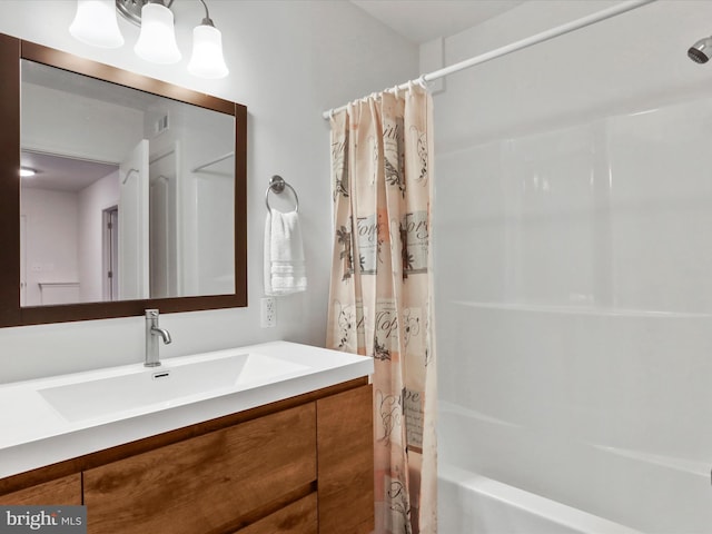 bathroom with shower / bath combo and vanity