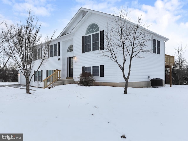 bi-level home featuring central AC unit