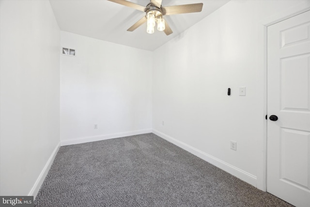 carpeted empty room featuring ceiling fan