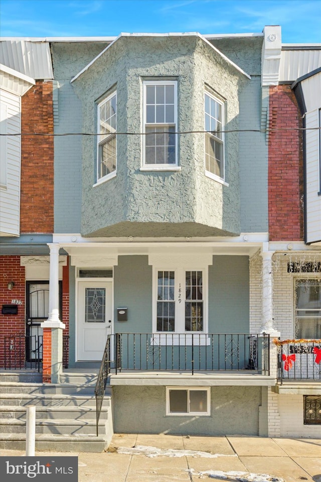 townhome / multi-family property featuring french doors