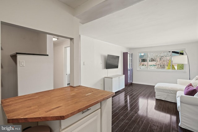 living room with dark hardwood / wood-style floors