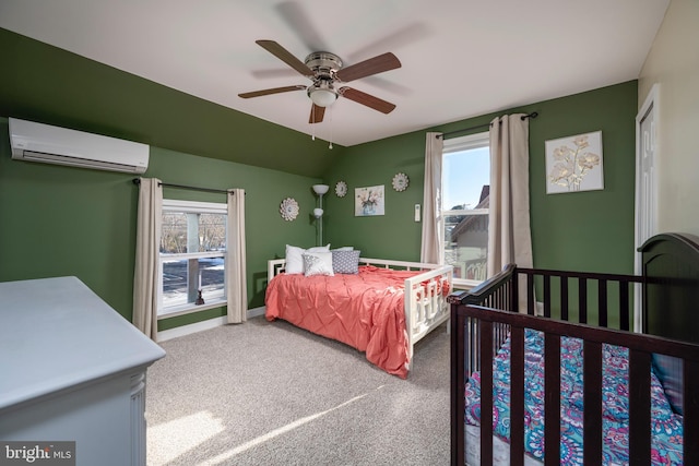 bedroom featuring multiple windows, carpet flooring, an AC wall unit, and ceiling fan