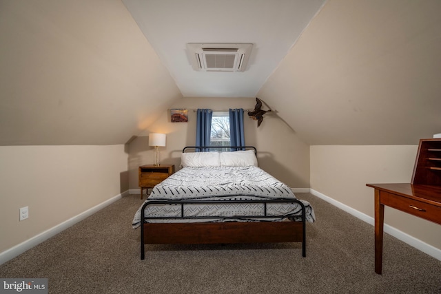 carpeted bedroom featuring a wall unit AC and vaulted ceiling