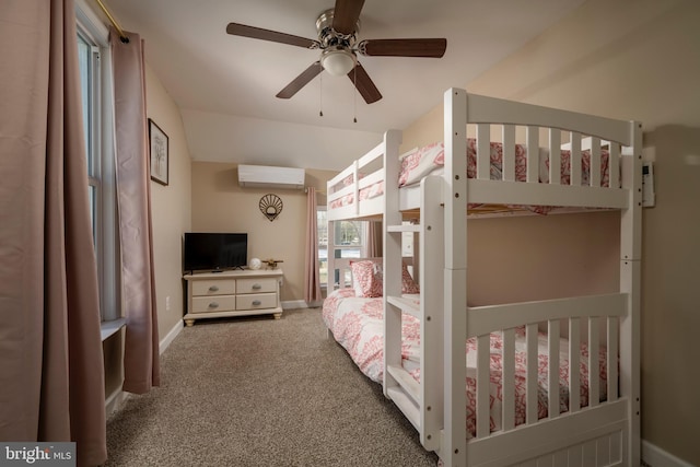 carpeted bedroom with a wall mounted AC, vaulted ceiling, and ceiling fan