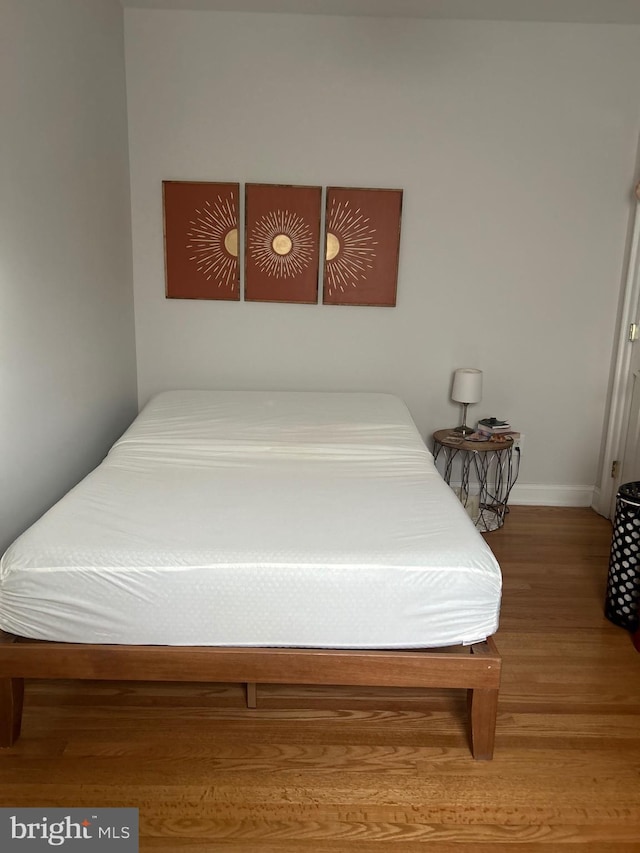 bedroom featuring wood-type flooring